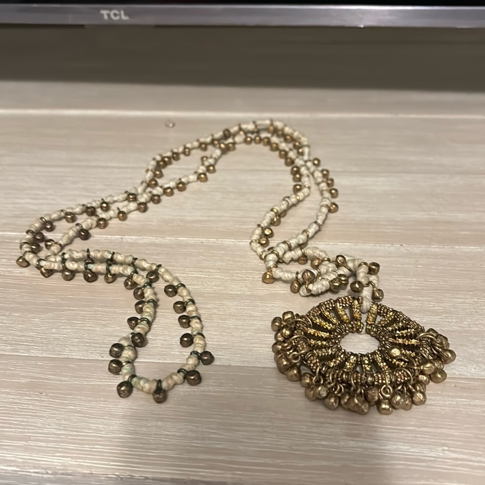 Sugarboo necklace with gold medallion.